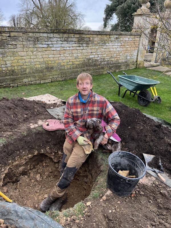 Gardener planting into freshly prepared soil